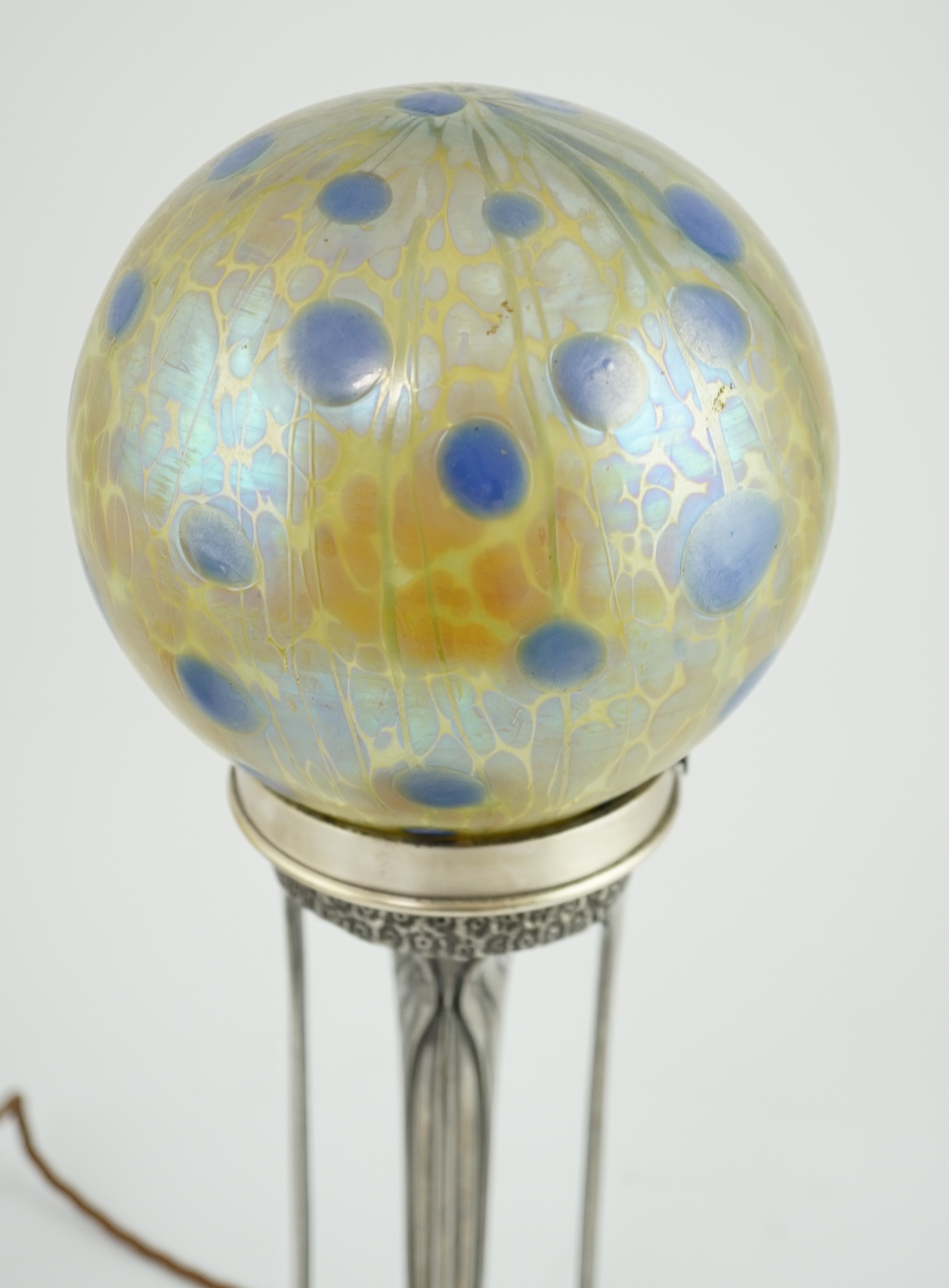 An Art Nouveau Orivit pewter table lamp with Loetz iridescent glass globular shade